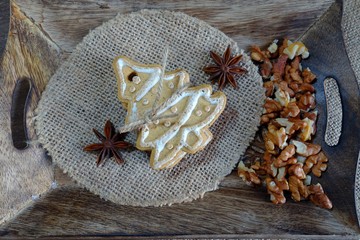 Decorative Christmas cookies, almonds, nuts, cinnamon and anise stars.Christmas sweets and nuts.
 ...