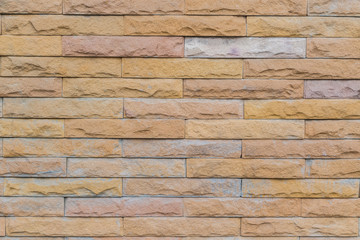 yellow stone wall  made with stone blocks