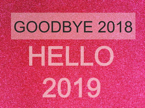 Goodbye 2018 Hello 2019, loading New Year words on Pink glitter texture Christmas abstract background.
