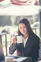 Young businesswoman on a coffee break .