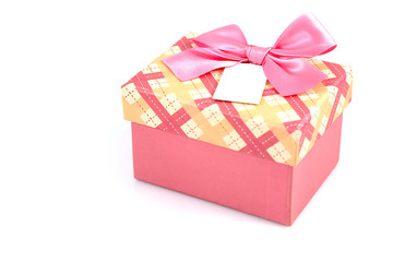 Pink gift box with ribbon bow isolated on white background