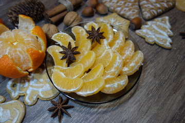Juicy peeled tangerines on a plate on Christmas.Still life, food and drink, seasonal and holidays concept
