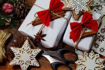 Christmas gifts and decoration on wooden table in retro style packing Christmas gifts
