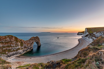 Durdle door at the Jurassic Coast in Dorset, England, at sunset