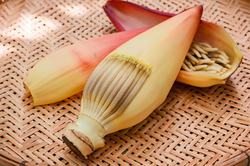 Banana blossom on bamboo tray.