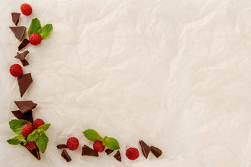 Colorful candy on a light paper background with a berry. A frame of sweets and sweets, free space