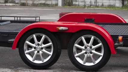 Red car trailer with two wheel axle