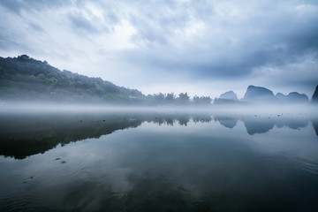 Fog on Li river Yangshuo China