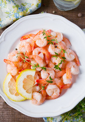boiled shrimps on wooden surface