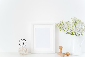 Vintage white frame mock up with host in jug,stamps on white background. Mockup for design. Template for bloggers, media