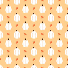 Cute vector seamless pattern background with pumpkins and maple leaves for autumn, thanksgiving and halloween design.
