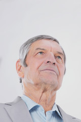 closeup.confident senior businessman looking up at copy space