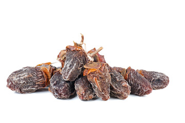 Pile of sun-dried persimmon fruits isolated on white background