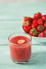 strawberry smoothie on wooden surface