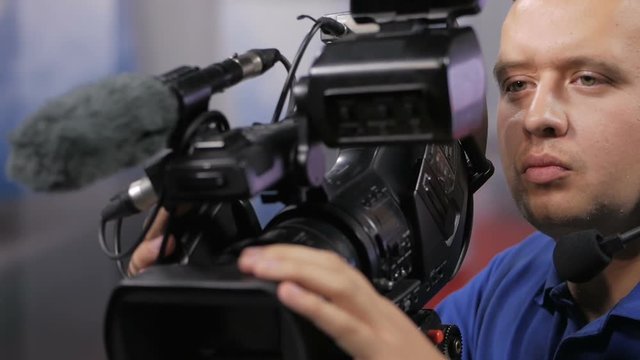 Camera operator working with a cinema broadcast TV camera