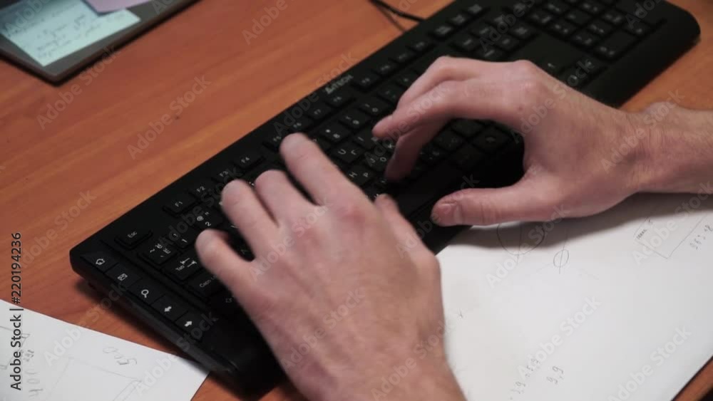 Poster close-up of typing male hands. clip. hands on keyboard. close-up of male hand before touching button