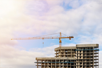 Tower crane on a background of clouds.