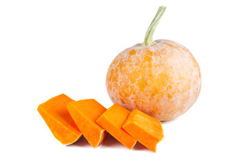 Whole pumpkin and slices isolated on white background