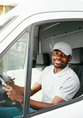 Courier Delivery. Black Man Driver Driving Delivery Car 
