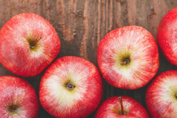 Harvest of ripe apples variety Red Delicious. Food background, top view, flat lay.