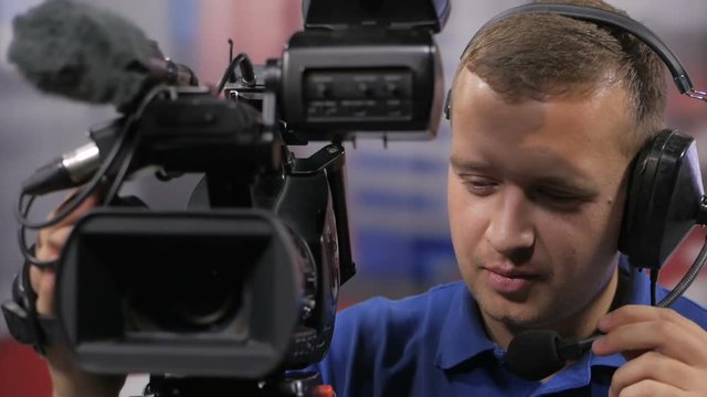 Camera operator working with a cinema broadcast TV camera