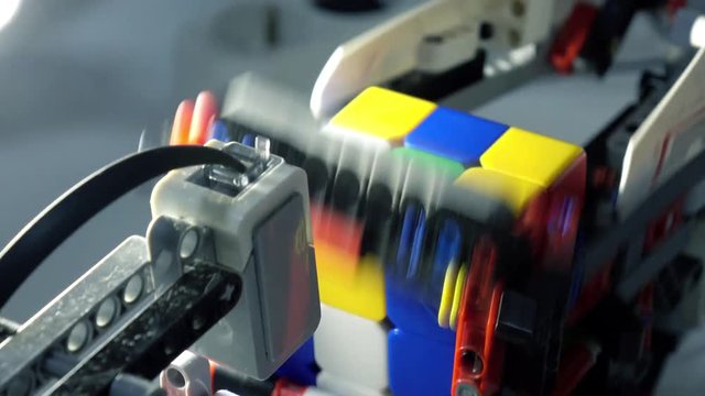 The robot collects Rubik's cube. Robotics.Science, technology. Artificial intelligence-AI