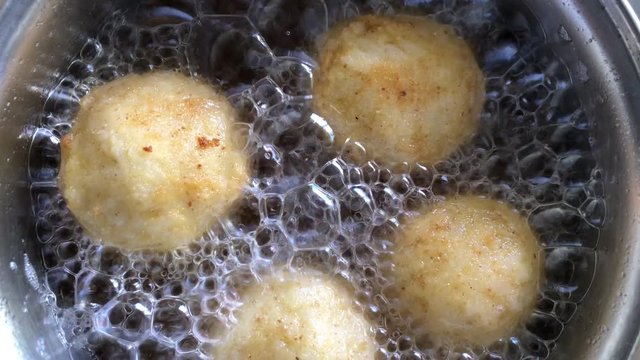 Frying rice balls stuffed with cheese filling, traditional French boulette de riz2