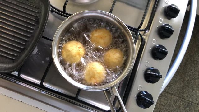 Frying rice balls stuffed with cheese filling, traditional French boulette de riz3