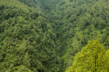 green mountain valley with waterfall