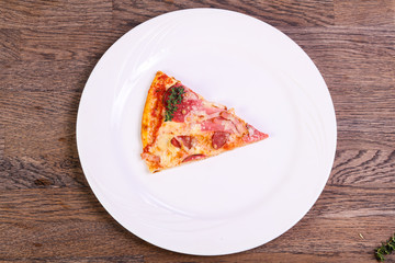 Pizza with ham and sausages