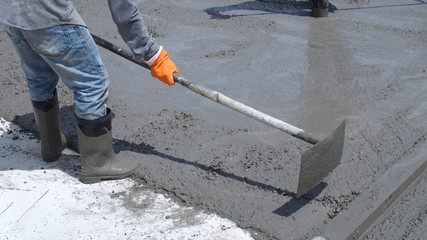 Skilled workers are working to concrete roads.