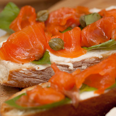 few delicious mouth-watering sandwich on white bread with salmon