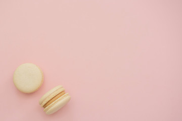 macaroons on a pink background. copy space. 