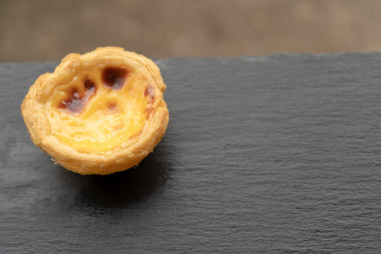 Delicious Asian Egg Tart From The Hong Kong Famous Shop On The Wood Table For Healthy Coffee Break In The Afternoon Tea