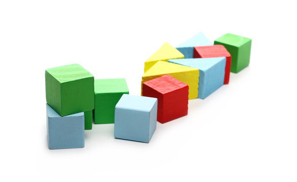 Wooden building blocks for children, isolated on white background 