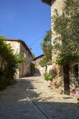 Traditional architecture in the narrow streets of travel destination Penne d'Agenais, Lot et Garonne, France. This idyllic hilltop village has extensive views.