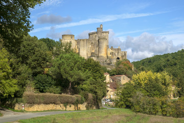 Fototapeta na wymiar View to imposing Chateau de Bonaguil near Fumel on a sunny autumn afternoon in Lot et Garonne, France