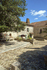 Picturesque architecture in early summer sunshine in Pujols, Lot-et-Garonne, France. This historic village is a member of 