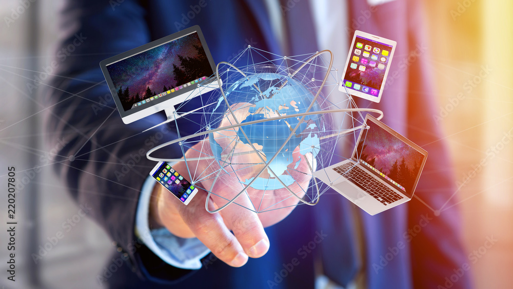 Poster businessman holding a computer and devices displayed on a futuristic interface with international ne