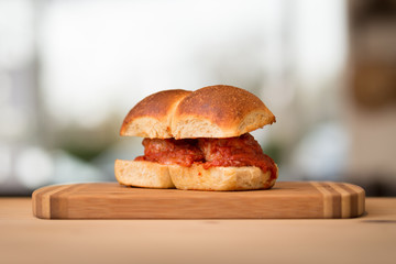 A homemade meatball sandwich on a nice brioche bun.