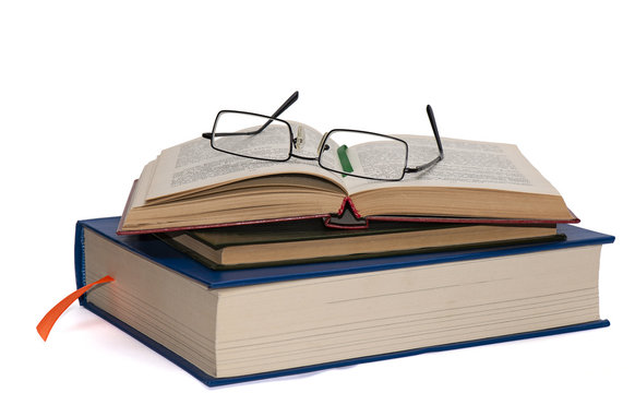 Glasses on open book