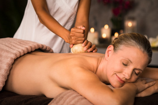 Mature woman having ayurvedic massage
