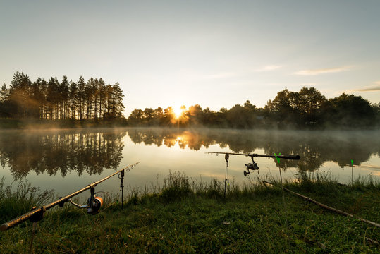 Carp fishing rods misty lake.