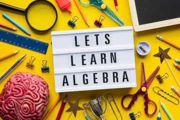 Lets learn algebra lightbox message on a bright yellow background