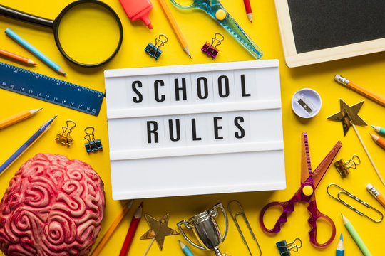 School rules lightbox message on a bright yellow background