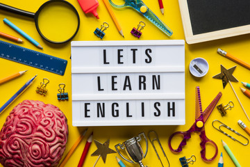 Lets learn english lightbox message on a bright yellow background - obrazy, fototapety, plakaty