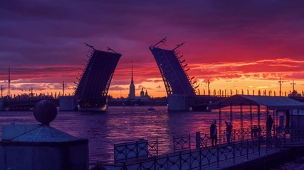 Sunrise on Neva River with Palace Bridge raised and Peter and Paul Fortress in background. Saint Petersburg, Russia. 4K UHD Timelapse.