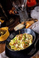 Reginette noodles in cream sauce with fresh chanterelles and capers