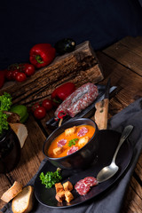 Hungarian paprika cream soup with spicy sausage