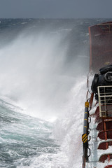 splashes of storm waves crashing against the ship
